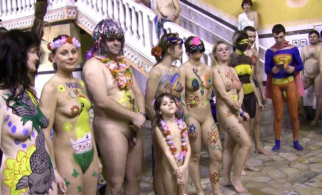 Parents and young nudists swimming in the pool video