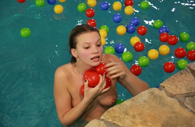 Family nudism photo in the water park